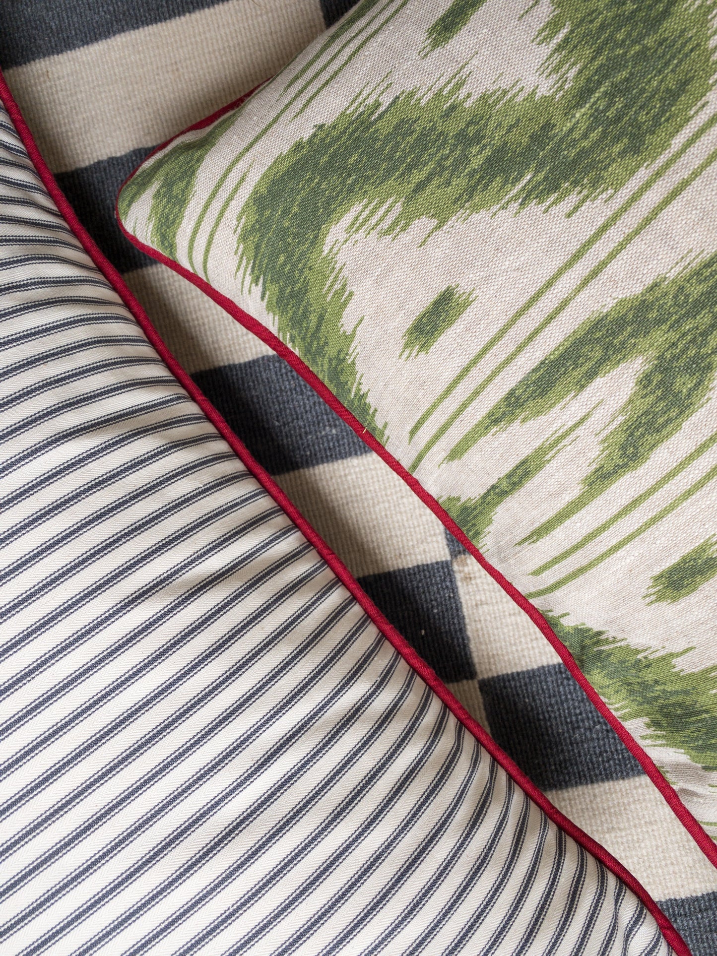 Green geo + red piping Cushion