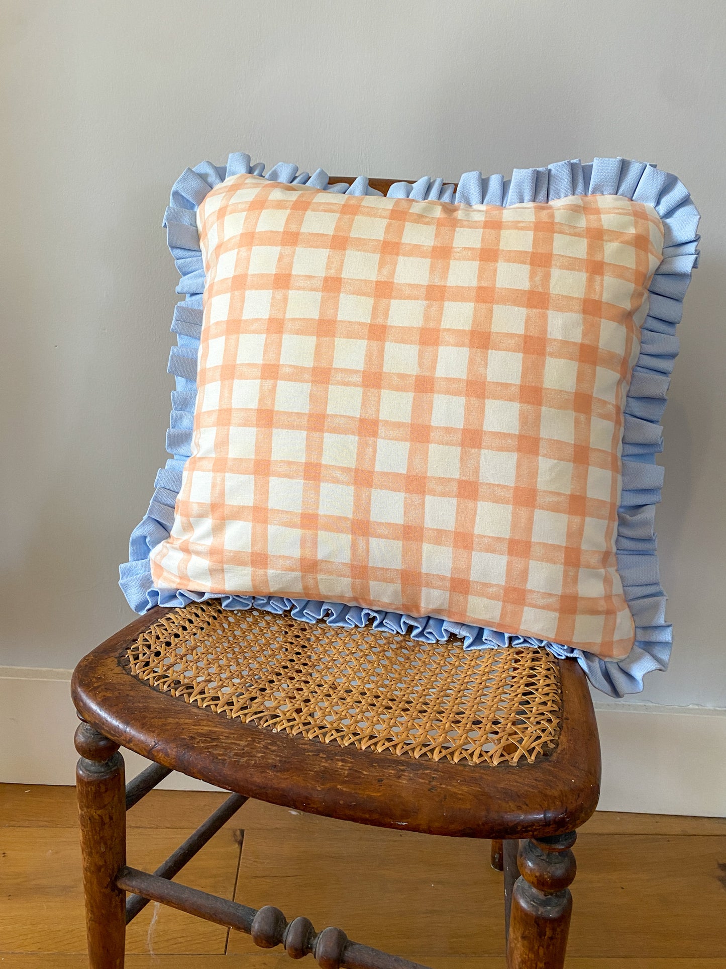 Peach gingham with pale blue frill Cushion