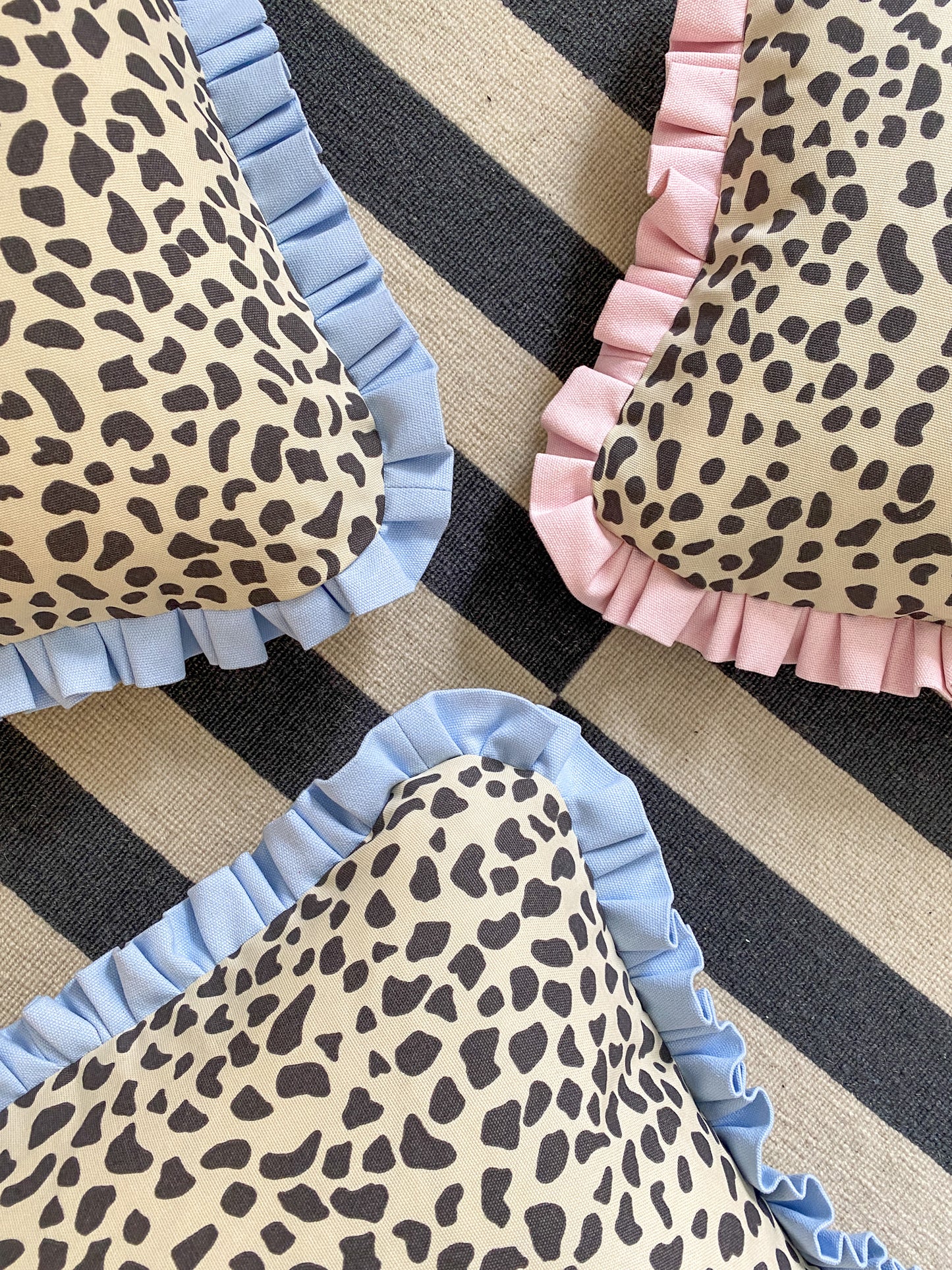 Black spots with pale pink frill Cushion