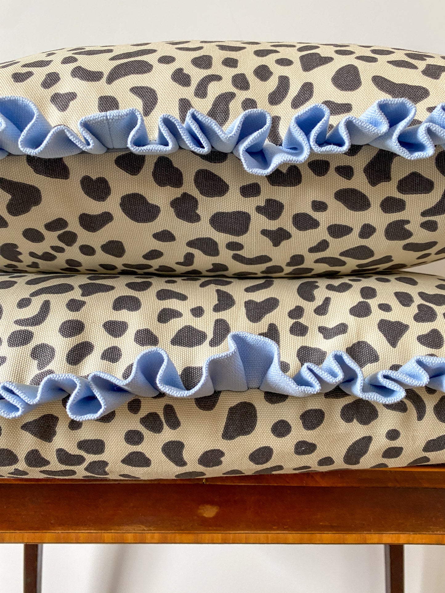 Black spots with pale pink frill Cushion